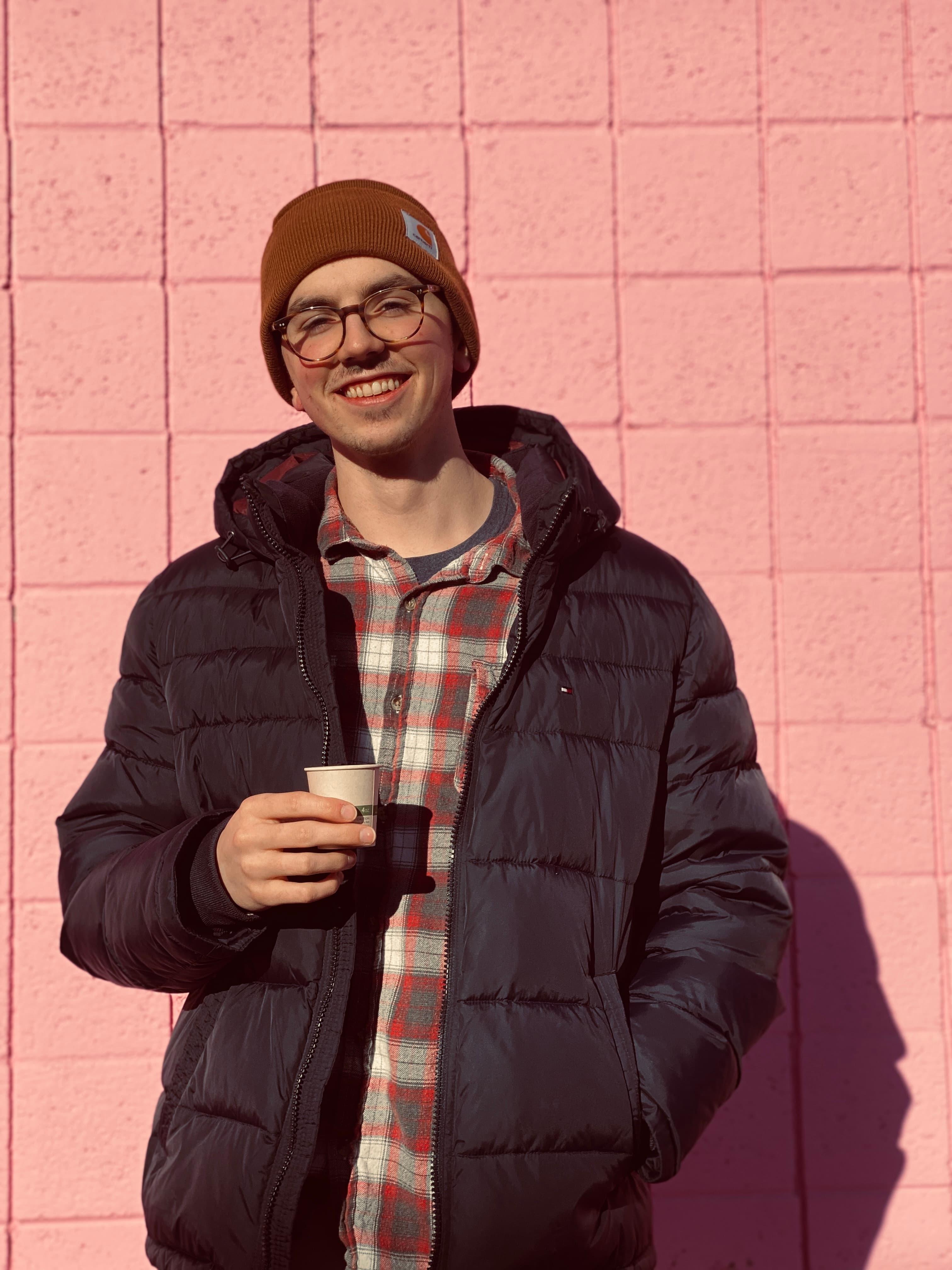 Evan holding an espresso at KLVN Coffee